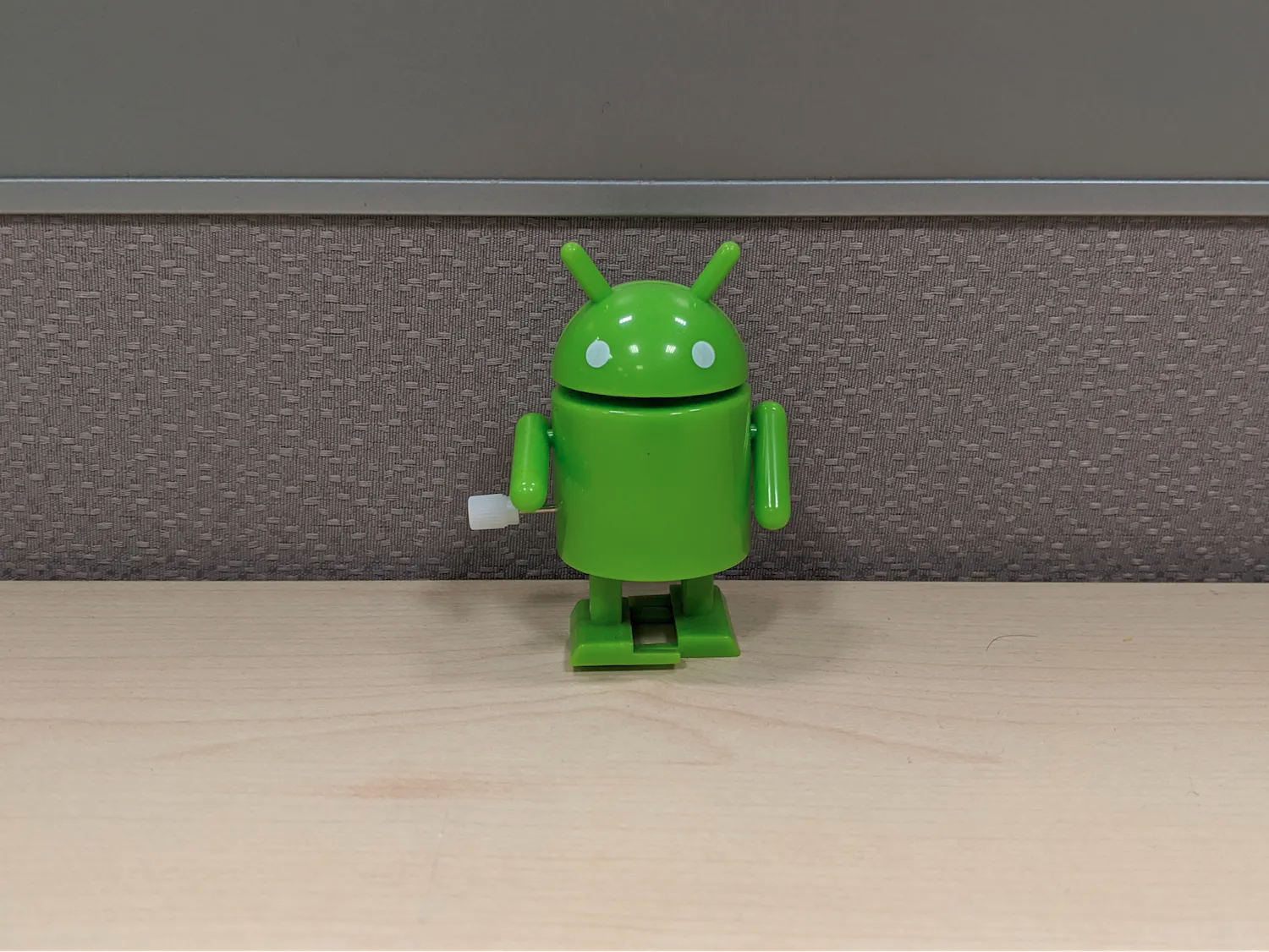 A landscape-shaped image with the bugdroid's head pointed upwards