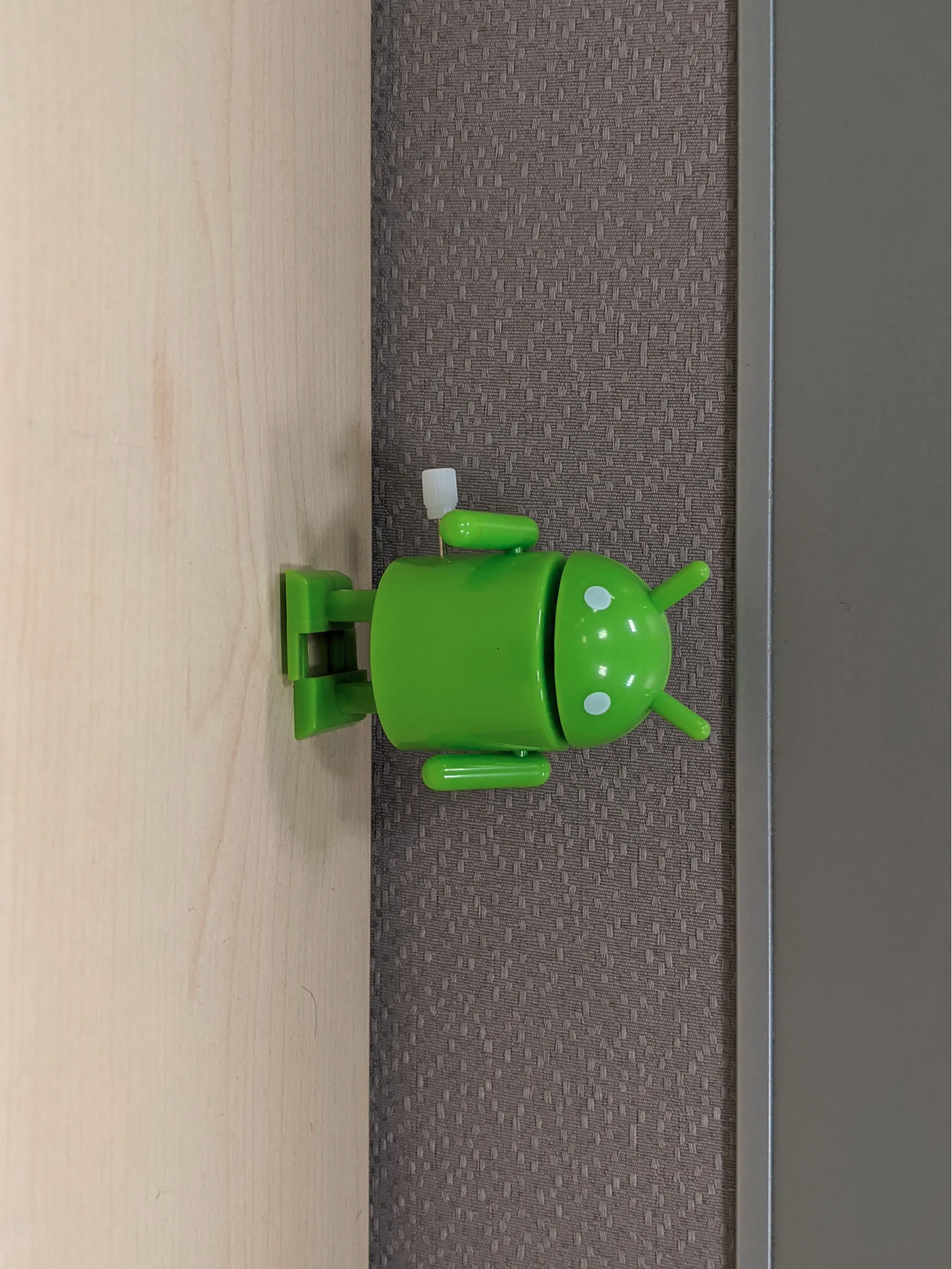 A portrait-shaped image with the bugdroid's head pointed to the right