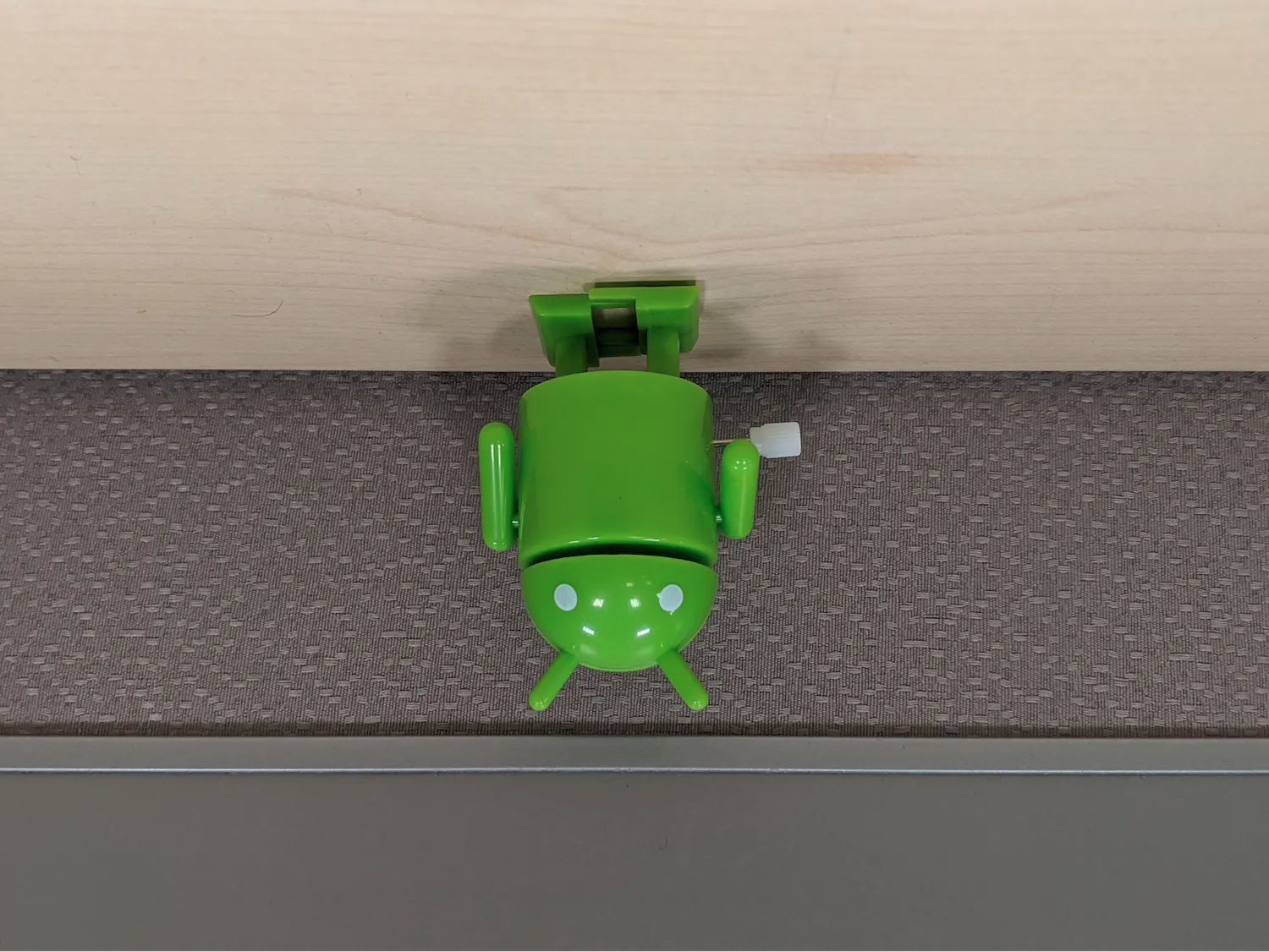 A landscape-shaped image with the bugdroid's head pointed downwards