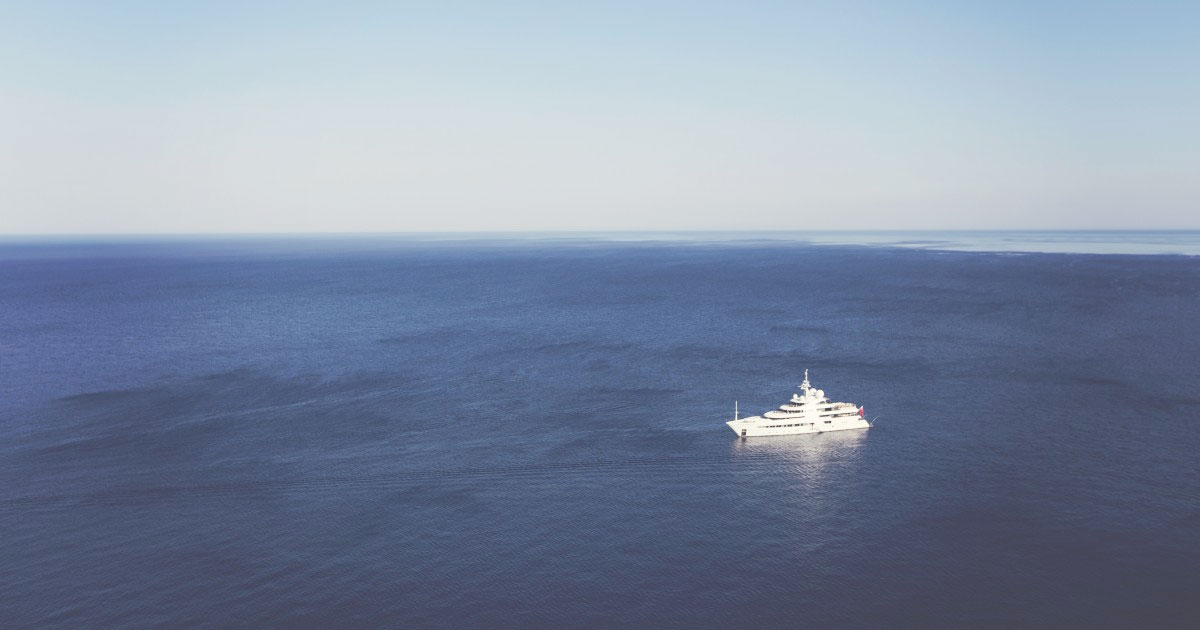 A white boat in the sea.