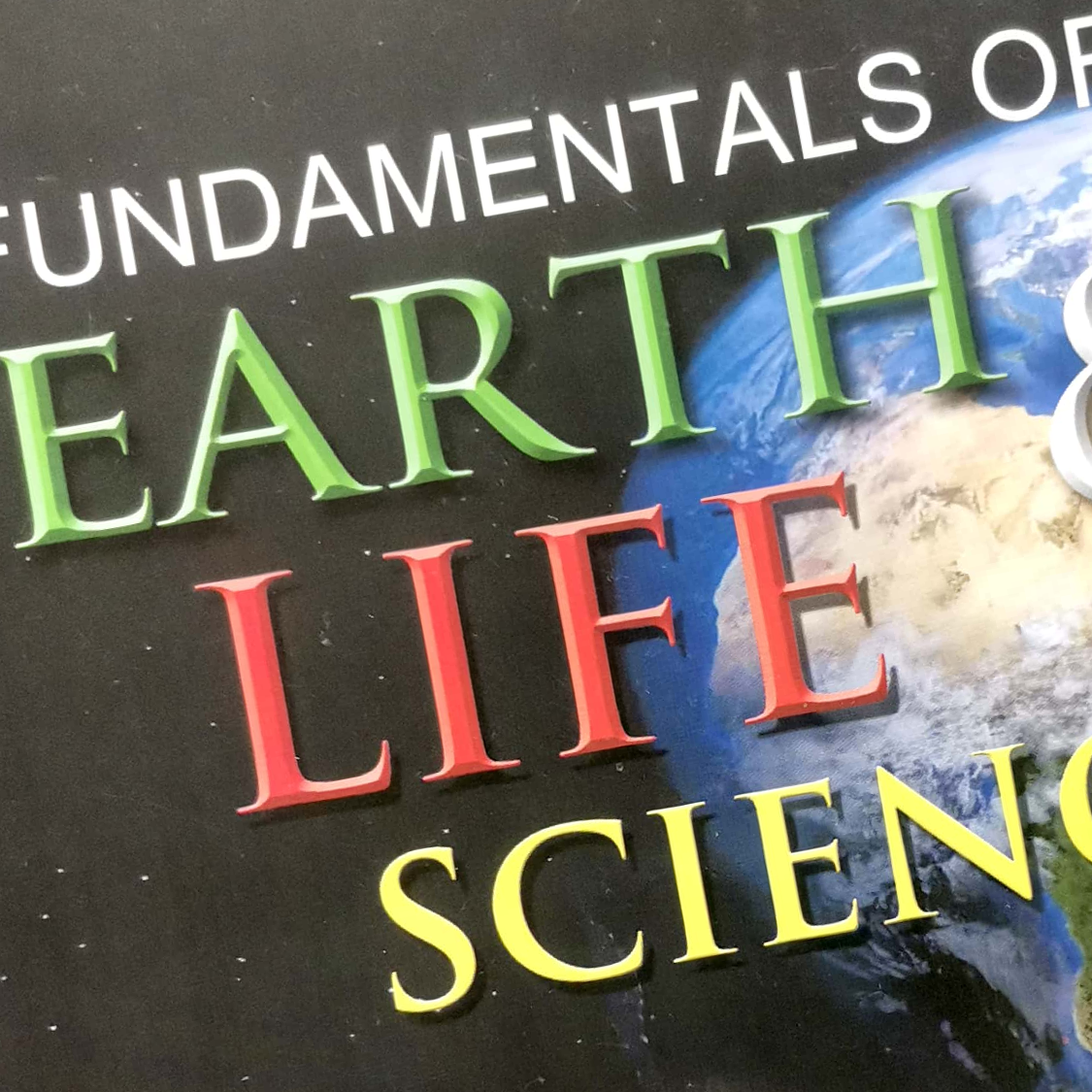 A photo of a textbook Earth and Life Science