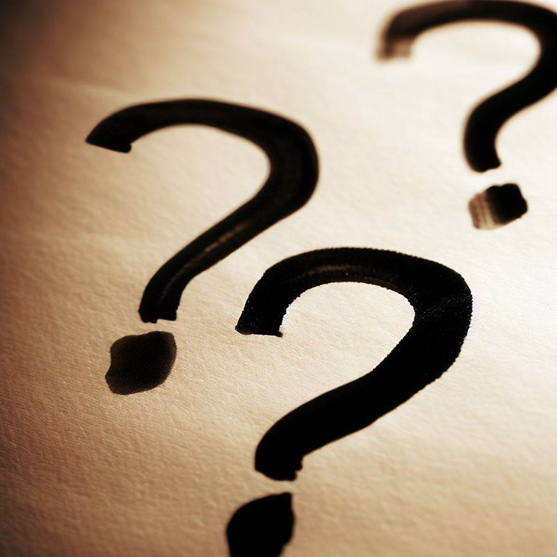 Question marks written on paper