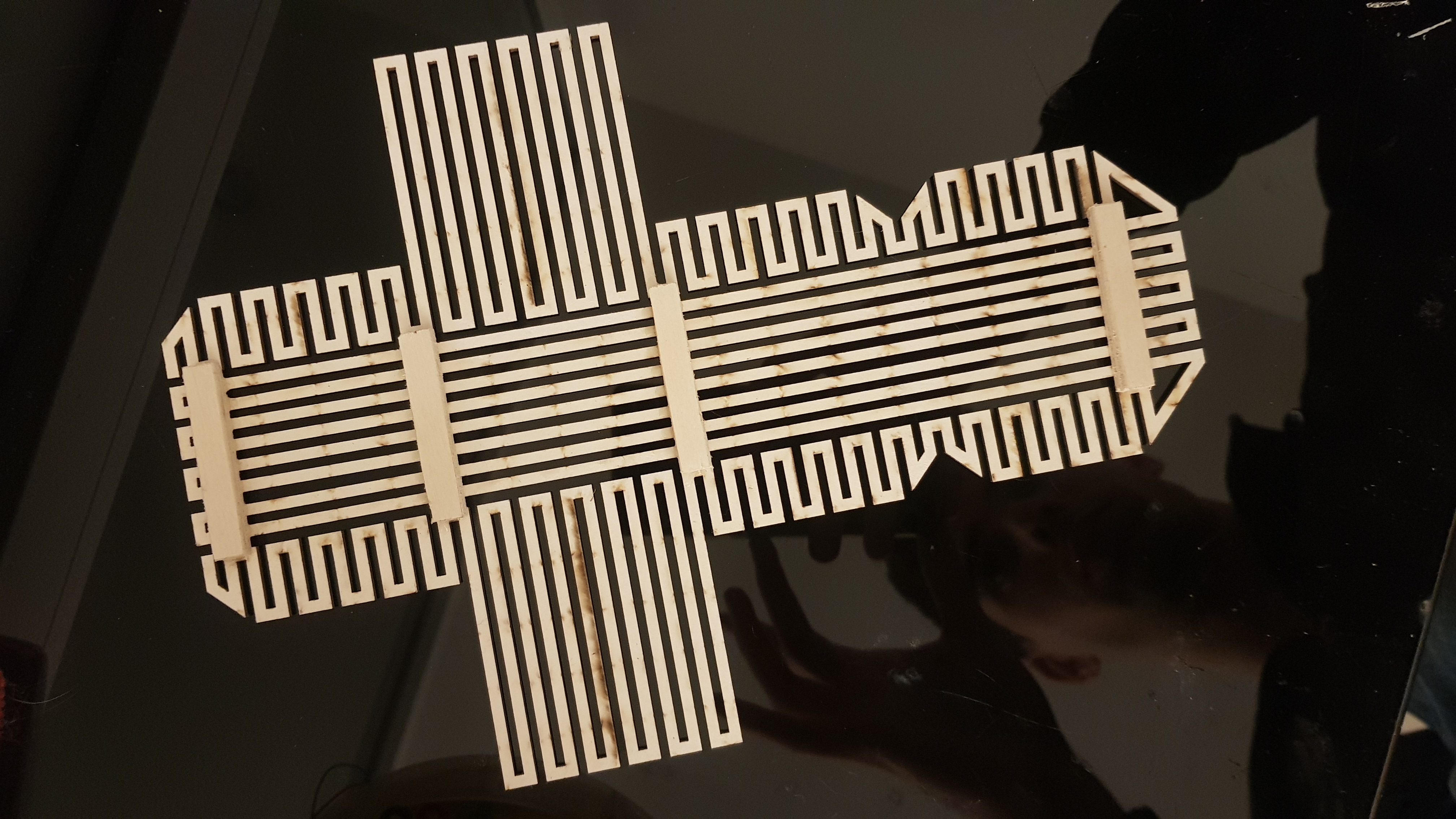 lasercut printed overlay used to cut metal tracks on paper